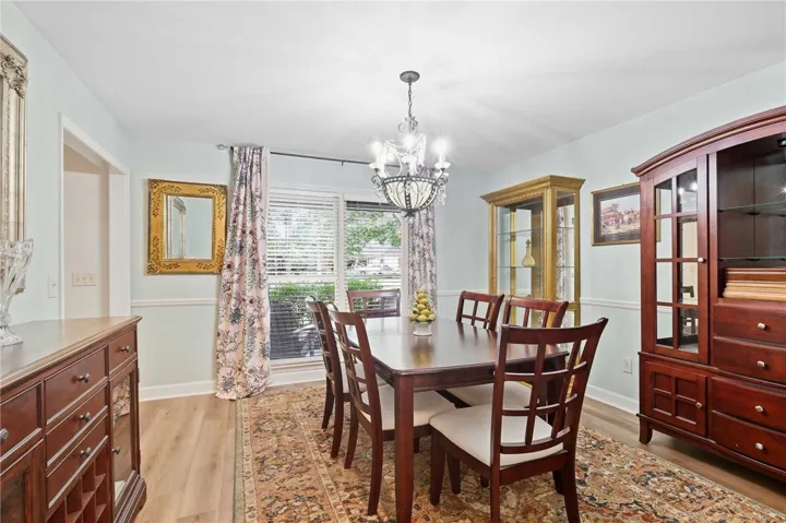 Crown molding and wood flooring establish an elegant tone in this formal dining area.