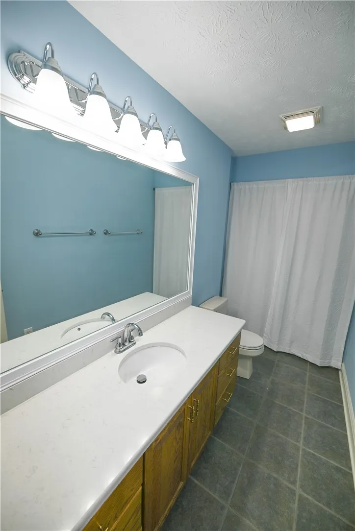 Upstairs hall bath with extended vanity.