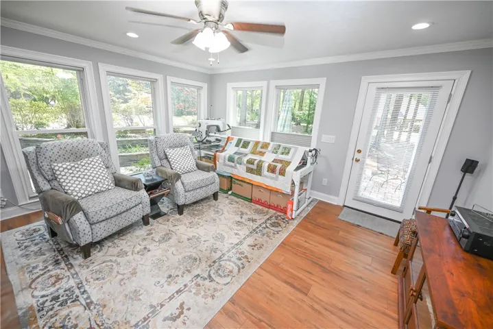 Lovely multi-use sunroom with direct patio access.