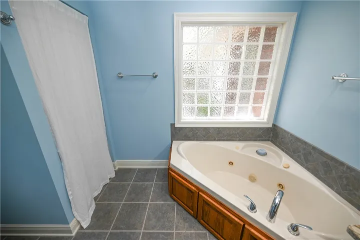 Luxurious jetted tub plus step-in shower.