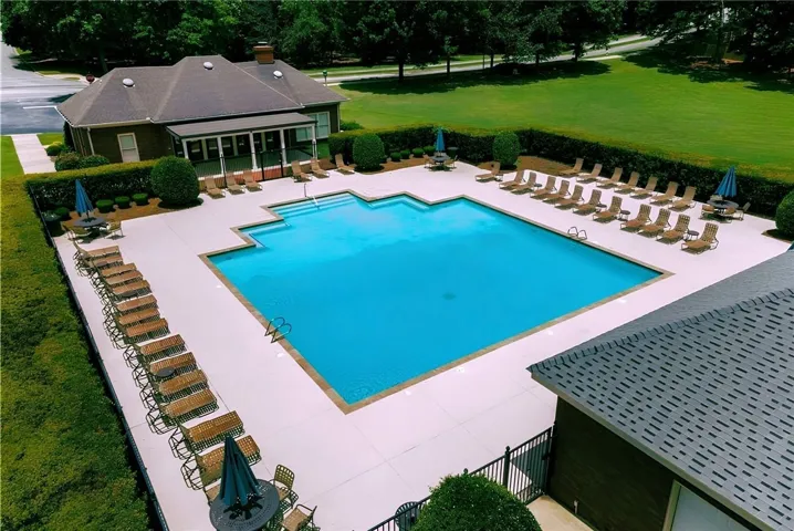Grove Hill clubhouse and 1 of 2 pools, surrounded by neighborhood greenspace.