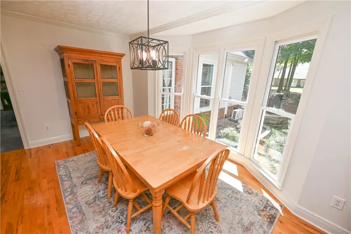 Breakfast room easily accommodates full-size table! (There's also a built-in desk organization station to the left.)
