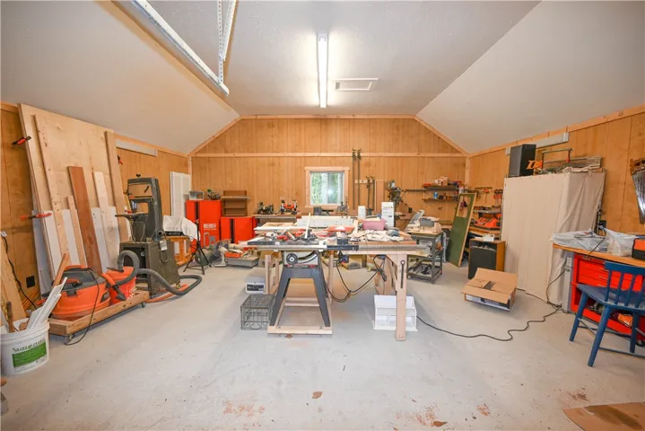 Workshop with concrete floors, plenty of receptacles. Even prewired for welder!