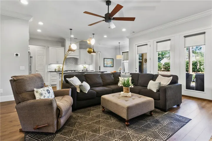 An open concept design seamlessly connects the main gathering space to the adjacent kitchen.