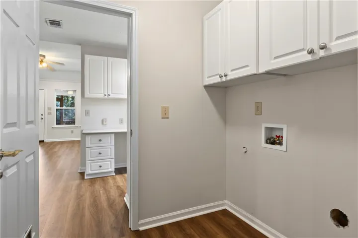 The laundry room has a closet which offers additional storage space.