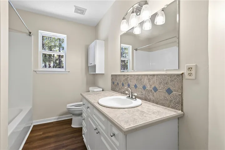 Hall bath with new LVP flooring and paint