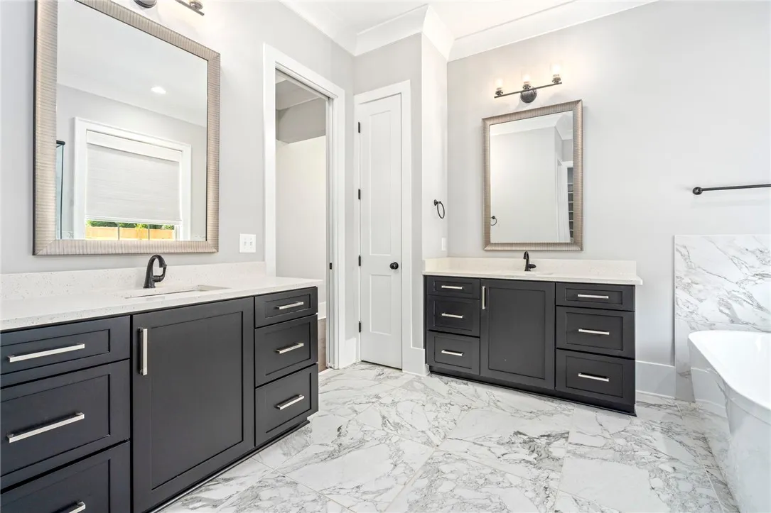 Two separate vanities provide lots of space and cabinetry
