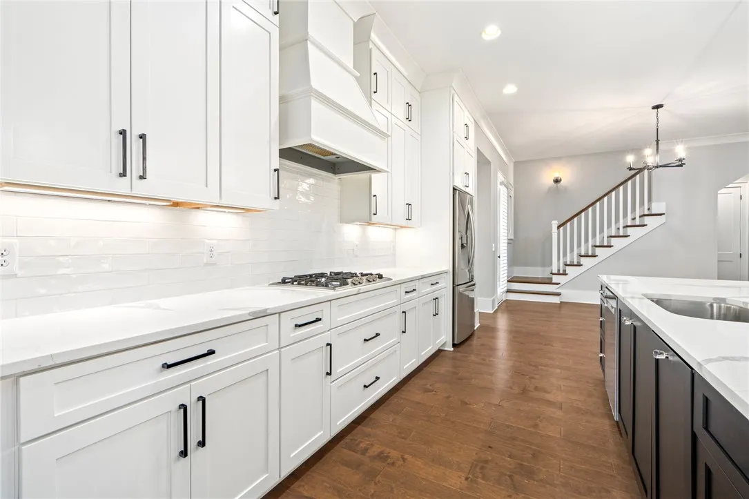 Gorgeous custom cabinetry and sleek countertops.