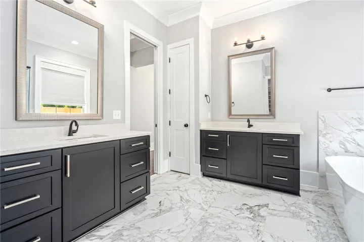 Two separate vanities provide lots of space and cabinetry