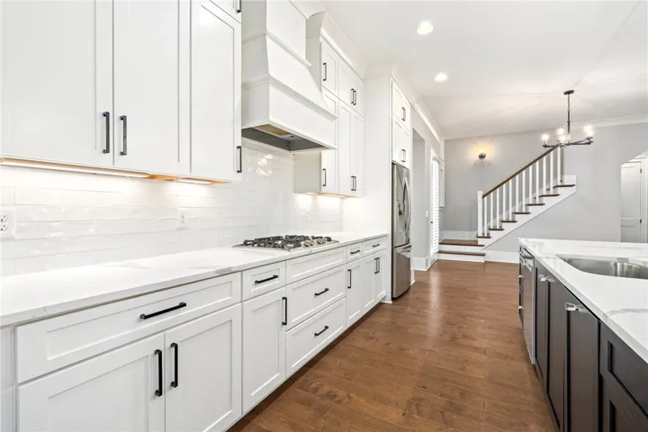 Gorgeous custom cabinetry and sleek countertops.