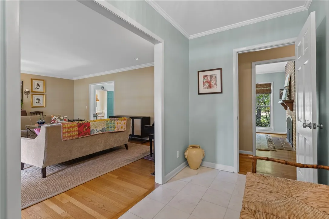 Crisp crown molding and durable tile floors frame this welcoming entry space.