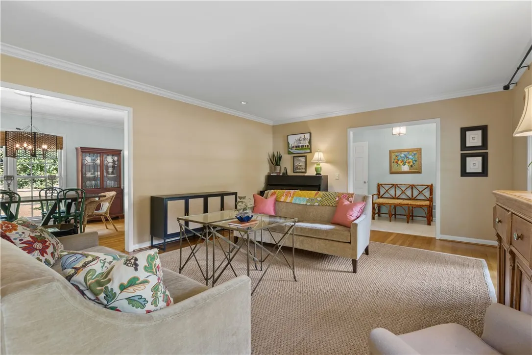 Elegant crown molding complements warm wood floors in an inviting, open layout.
