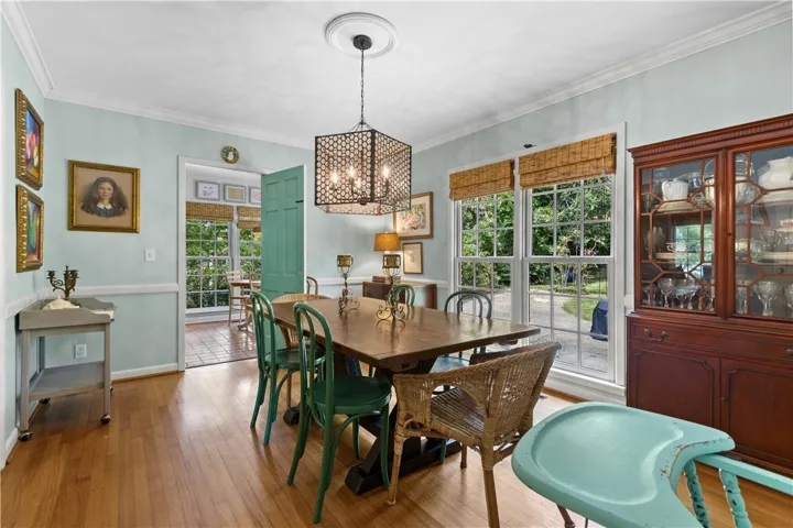 Gleaming hardwood floors and classic crown molding accent this inviting dining space.