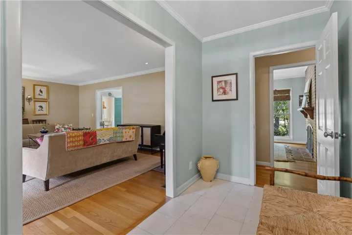 Crisp crown molding and durable tile floors frame this welcoming entry space.