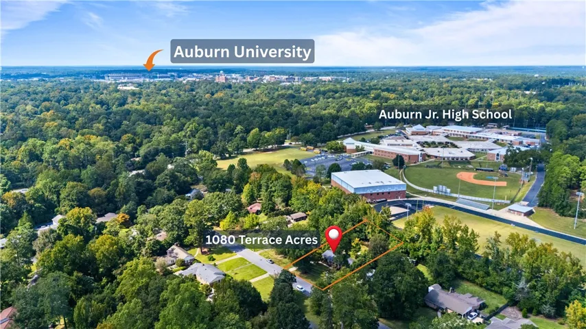 Mature trees surround this prime neighborhood location near local schools and the Auburn University campus facilities.