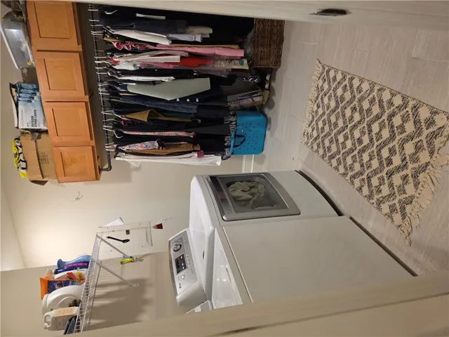 Ample built-in storage cabinets and durable tile flooring highlight this functional workspace.