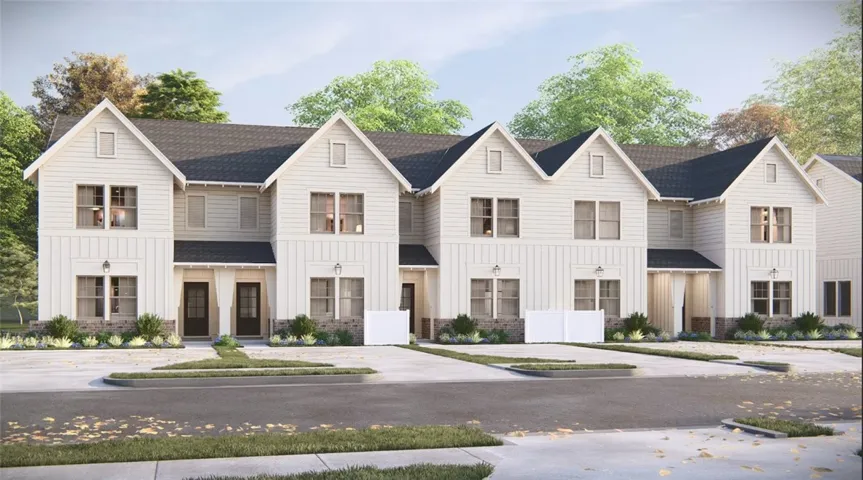 Classic gables and clean siding define the exterior of these modern multi-level townhomes.