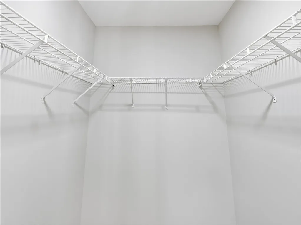 Continuous wire shelving wraps around this functional storage space.