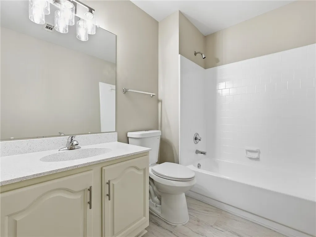 Clean lines and a functional layout define this classic full bathroom.