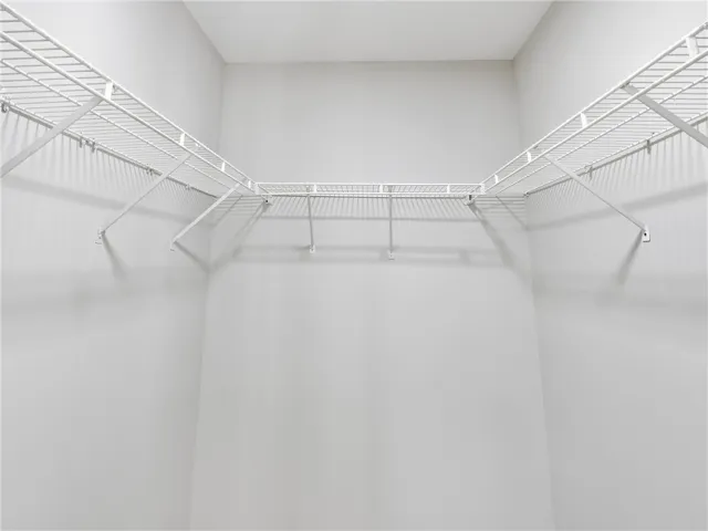 Continuous wire shelving wraps around this functional storage space.