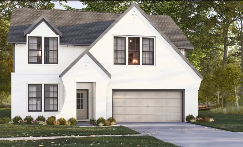 An elegant modern farmhouse exterior stands tall amidst lush surrounding trees.