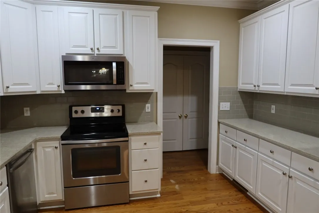 Ample counter space and classic cabinetry define this well-appointed kitchen.