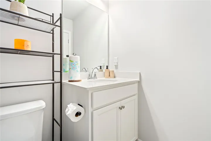 Clean lines and a stone counter highlight this classic bathroom vanity.