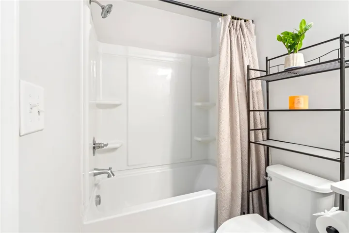 Clean lines and classic white finishes define this functional bathroom space.