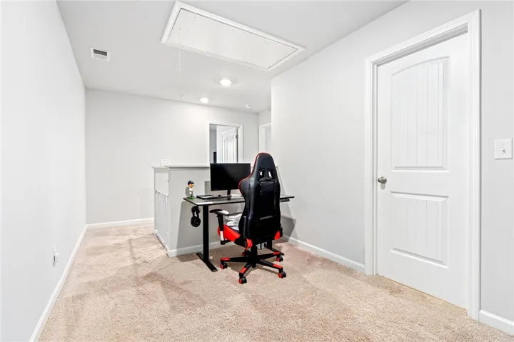 A versatile upper-level landing offers plush carpeting and recess lighting.