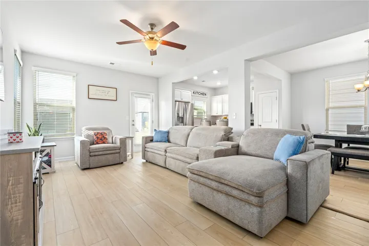 Gleaming hardwood floors and wide entryways connect this spacious main level living area seamlessly.