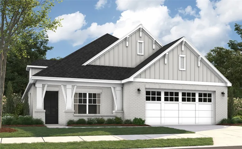 Steep gables and classic brickwork define this newly constructed modern farmhouse elevation.