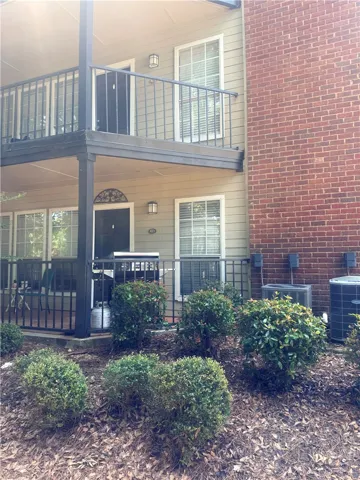 A classic brick exterior blends seamlessly with siding on this multi-level residential building.