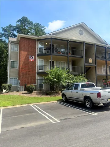 Multi-level residential architecture features a combination of brick and siding siding accents.