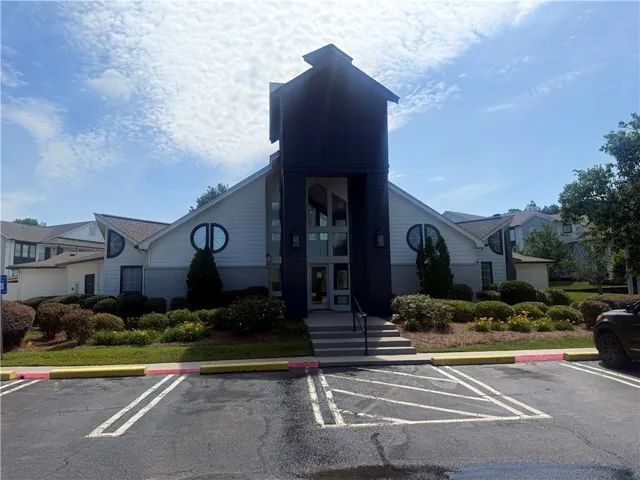 Distinctive architectural design defines this welcoming multi-level clubhouse exterior.