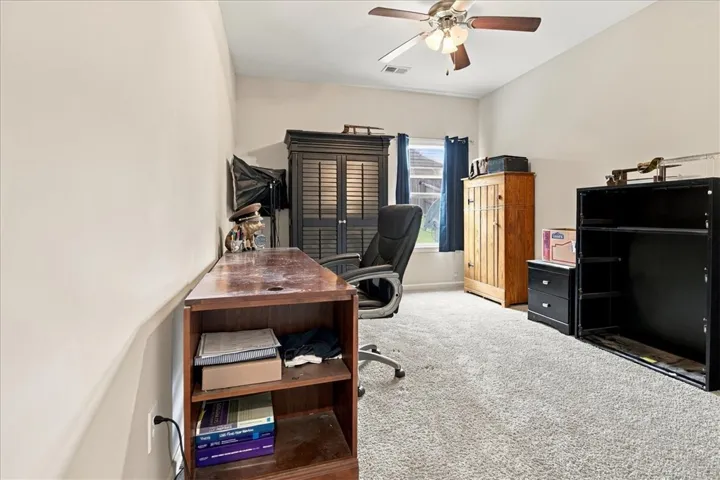 Downstairs bedroom has its own adjacent bathroom in the hall, and is currently being used as an office