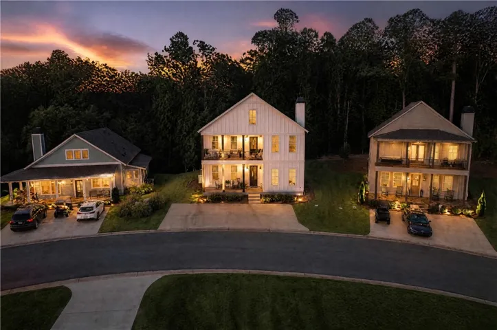 Striking modern board and batten siding commands attention in a peaceful neighborhood setting.