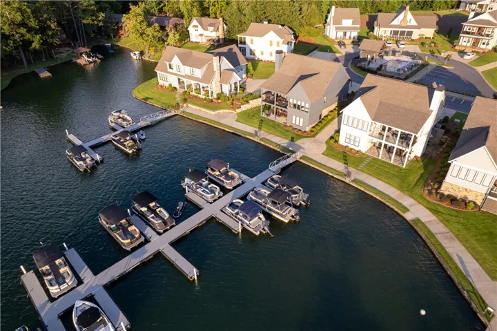 Scenic waterfront views unfold across this vibrant lakeside community featuring private docks.