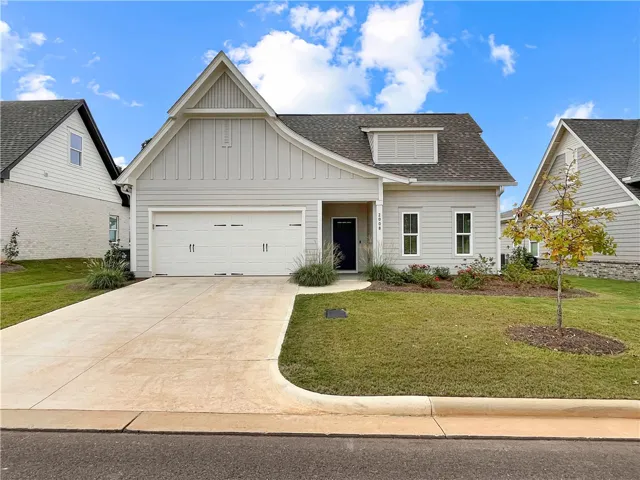 Clean architectural lines and a manicured lawn define this craftsman-inspired exterior design.
