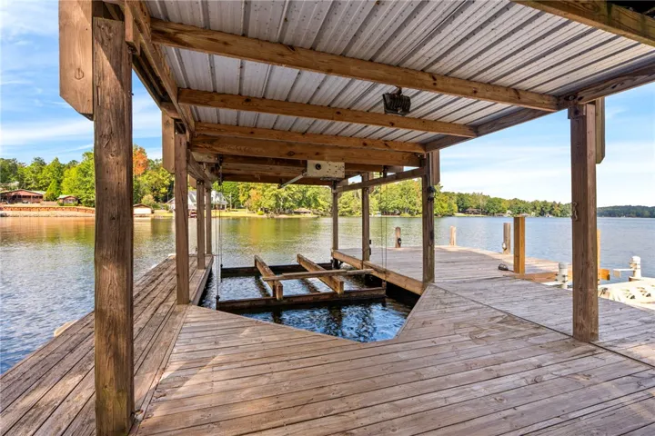 A spacious covered boat dock provides direct access to calm lake waters.