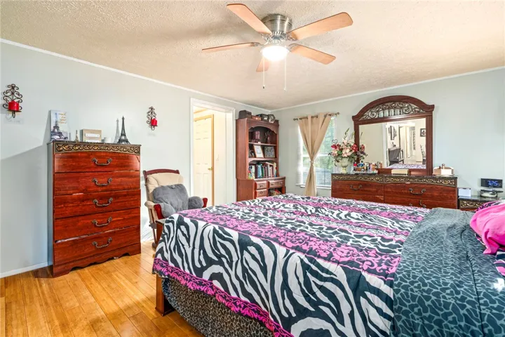 Gleaming hardwood floors run throughout this comfortable bedroom layout.
