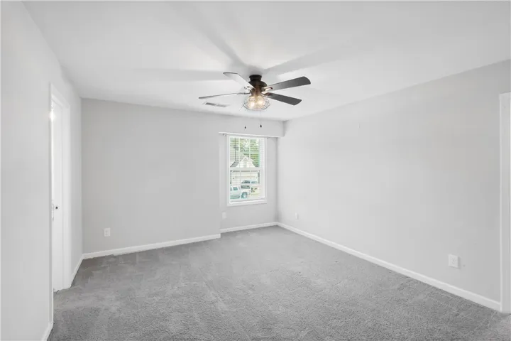 Plush wall-to-wall carpeting and clean baseboards define this versatile upper-level room.