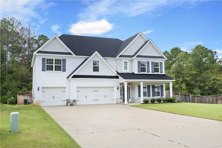 Crisp white masonry paired with clean architectural lines defines this striking multi-level exterior.