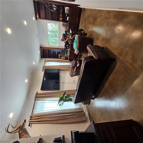 Gleaming concrete floors and tall windows anchor this versatile home​​‌​​​​‌​​‌‌​‌‌​​​‌‌​‌​‌​‌​​​‌​​ office.