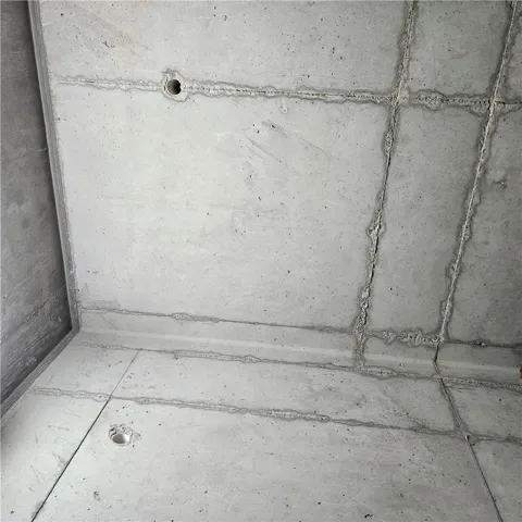 Industrial style defines this space with raw concrete surfaces on both walls and flooring.