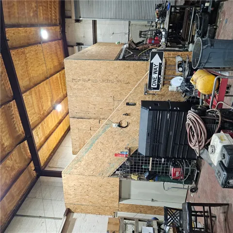 High ceilings and durable concrete flooring define this versatile, industrial-scale workshop space.