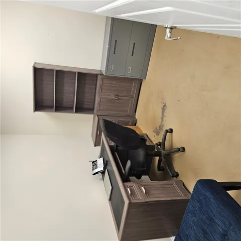A functional workspace with ample storage space is ideal for a quiet home office.