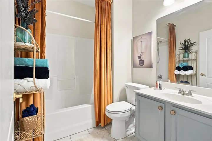 Clean lines and classic tiling define this well-appointed guest bathroom.