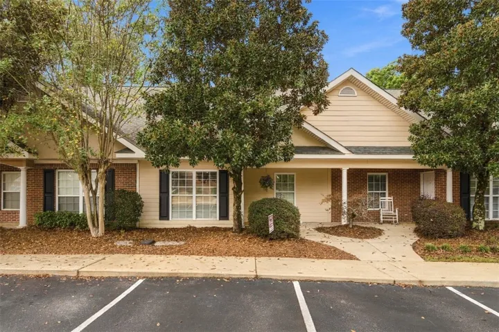 Brick and siding accents create classic curb appeal along this welcoming front entry.