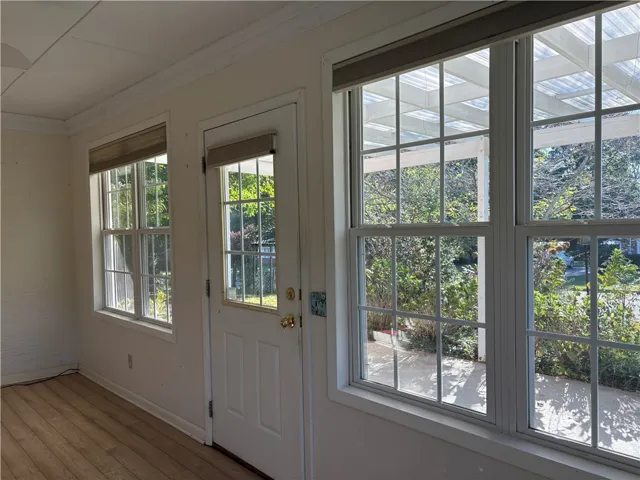 Natural light streams through multiple vinyl clad, insulated windows across this inviting sun room