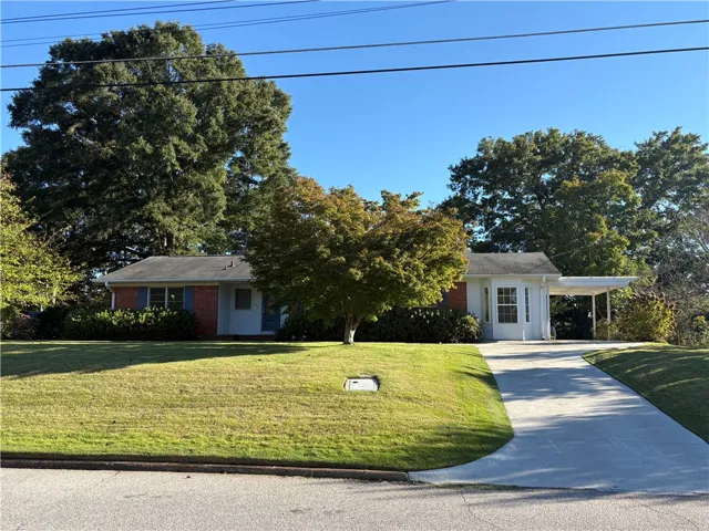 Well maintained brick home on large corner lot